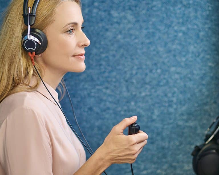 Audiologist administering a hearing test.