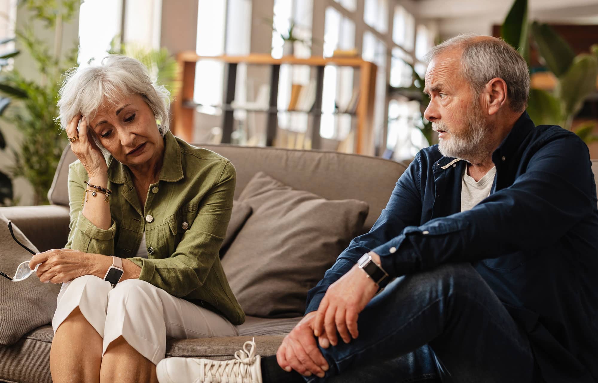 Older adults having a conversation at home.