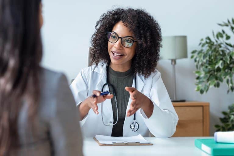 A patient receives care at a follow-up appointment at Shoreline Hearing Center.